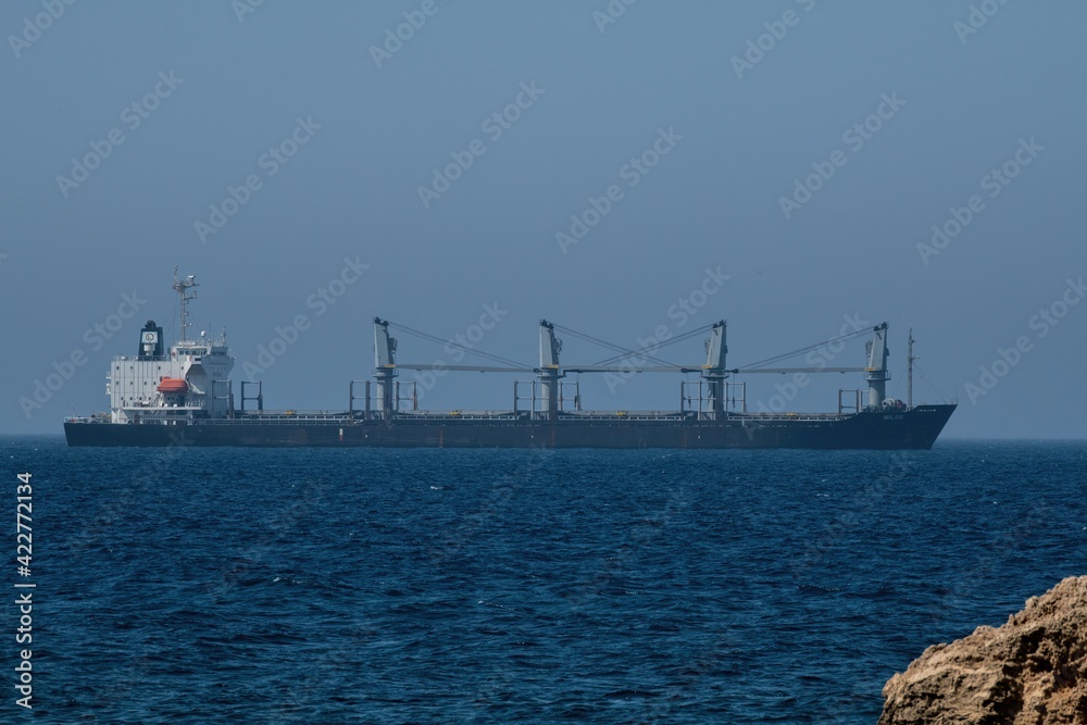 freight ship anchored in a distance at the Mediterranean coast in Lebanon