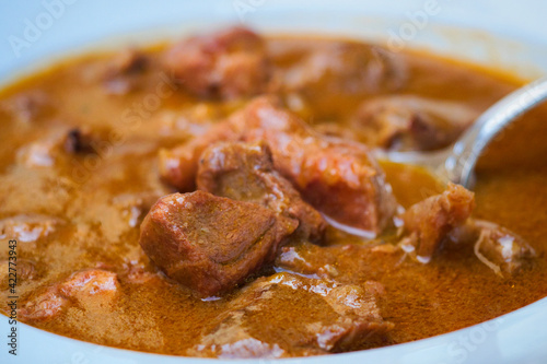 Traditional Croatian rustic meat dish - venison gulash with rich berry and mushroom sauce 