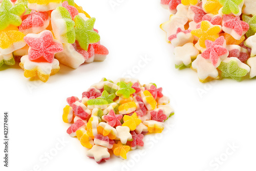 Juicy colorful jelly stars sweets isolated on white. Gummy candies.