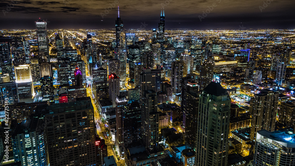 Aerial view of Chicago downtown at night from John Hancock skyscraper high above