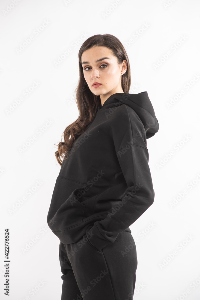 Fashion woman wearing warm hoodie on white background Fashion woman wearing warm hoodie on white background