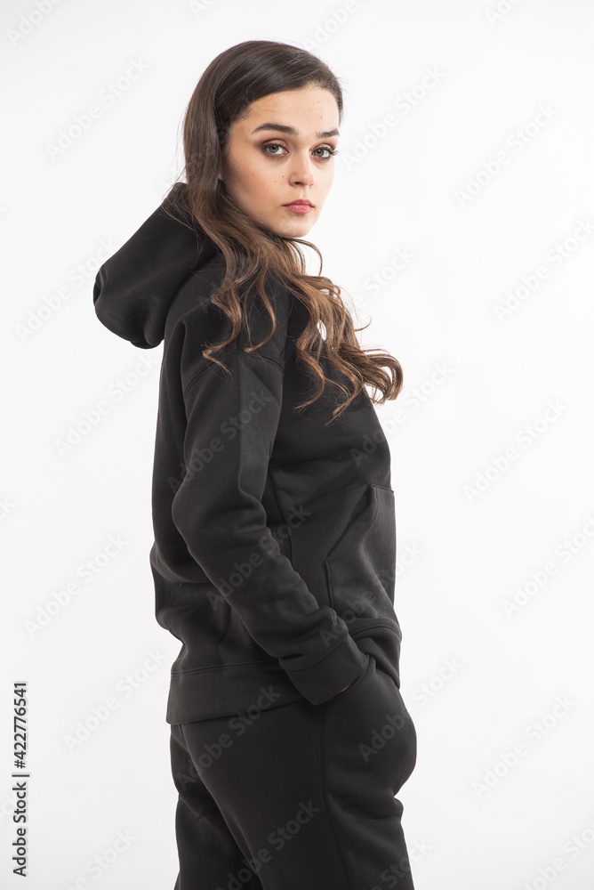Woman in a warm fleece suit, studio shooting. Casual hoodie Woman in a warm fleece suit, studio shooting. Casual hoodie