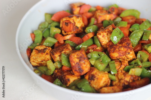 Tawa roasted paneer with sauteed carrots and capsicum. photo