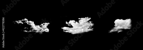 White fluffy clouds on a black sky background. Illustration