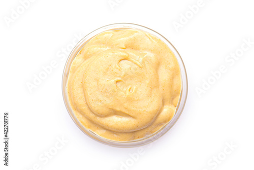 Mustard sauce in small glass bowl, isolated in white. Mustard sauce as dressing