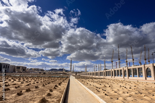 Jannat al Baqi  along with a beautiful cloudy  sky photo