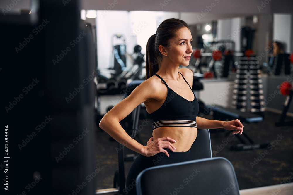 Portrait of kind woman that standing near simulator Portrait of kind woman that standing near simulator