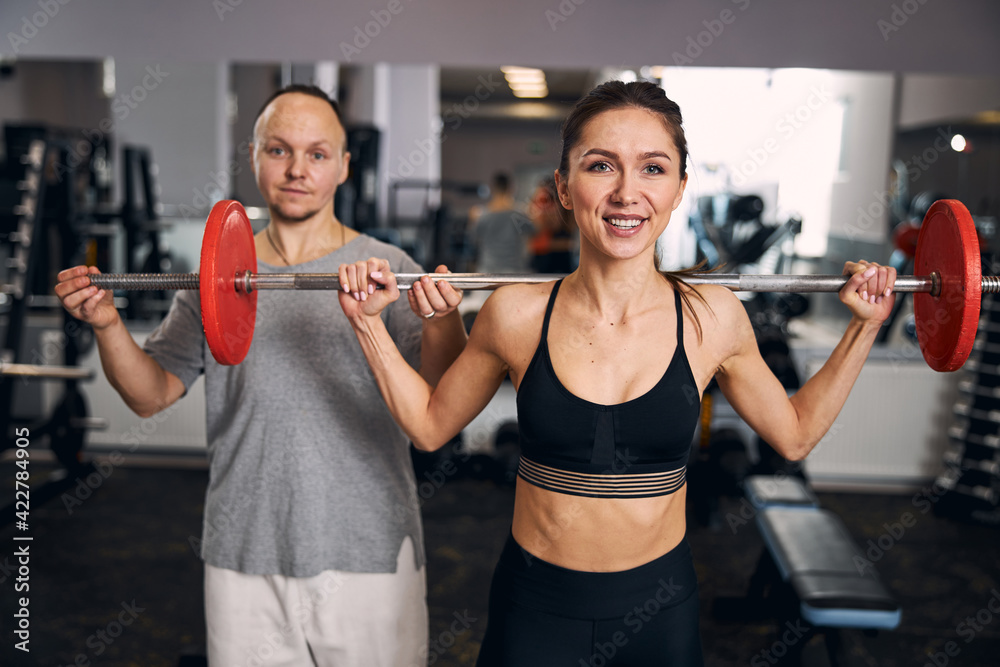 Positive delighted woman working on great result Positive delighted woman working on great result