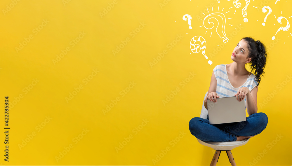 Question marks with woman using a laptop - obrazy, fototapety, plakaty 