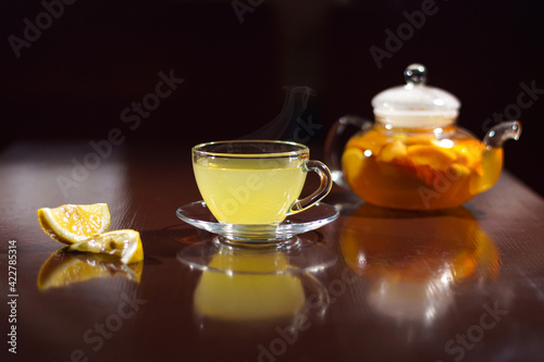 Hot drink with lemon. Hot tea with lemon. Hot cocktail with lemon.
