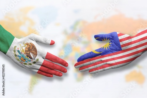 Mexico and Malaysia - Flag handshake symbolizing partnership and cooperation
