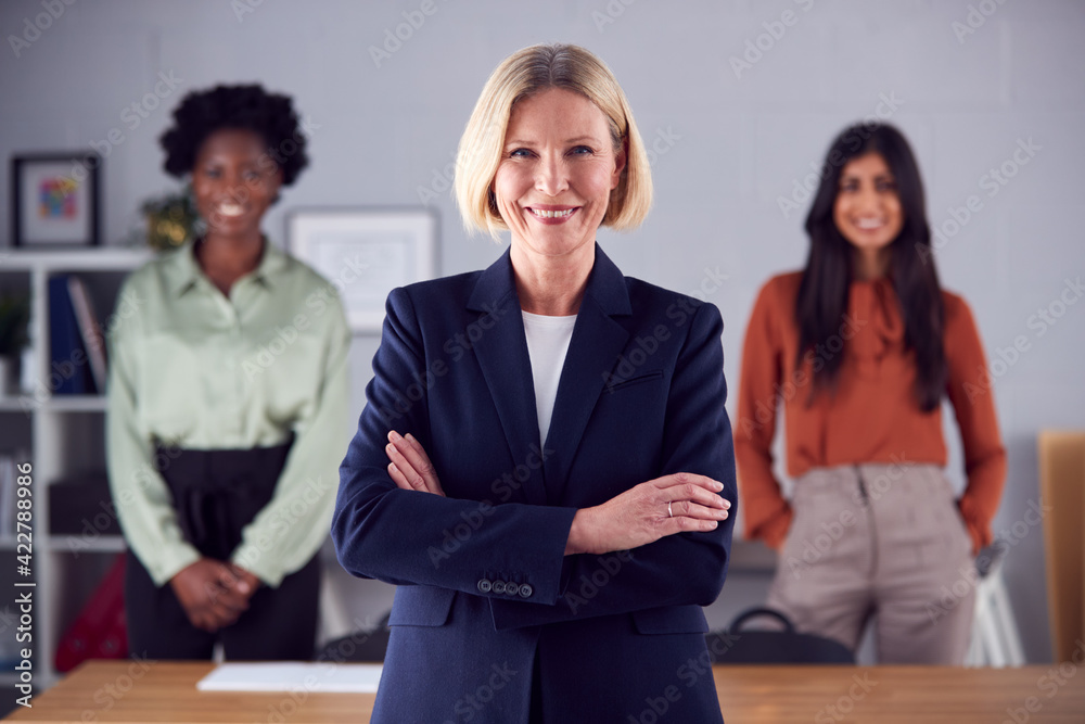 Portrait Of Female Multi-Racial Business Team Standing In Office Portrait Of Female Multi-Racial Business Team Standing In Office