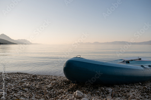 Low angle view of a sup board on shore