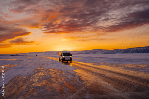 A car crossing a frozen lake