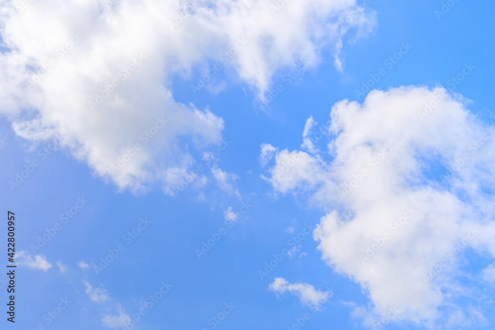 White clouds on the blue sky for background.