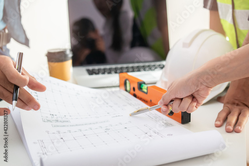 Quadro em tela Group business, Team of young colleague, contractor or engineer brainstorming, discussing plan, project on blueprint ,paperwork at workplace, office