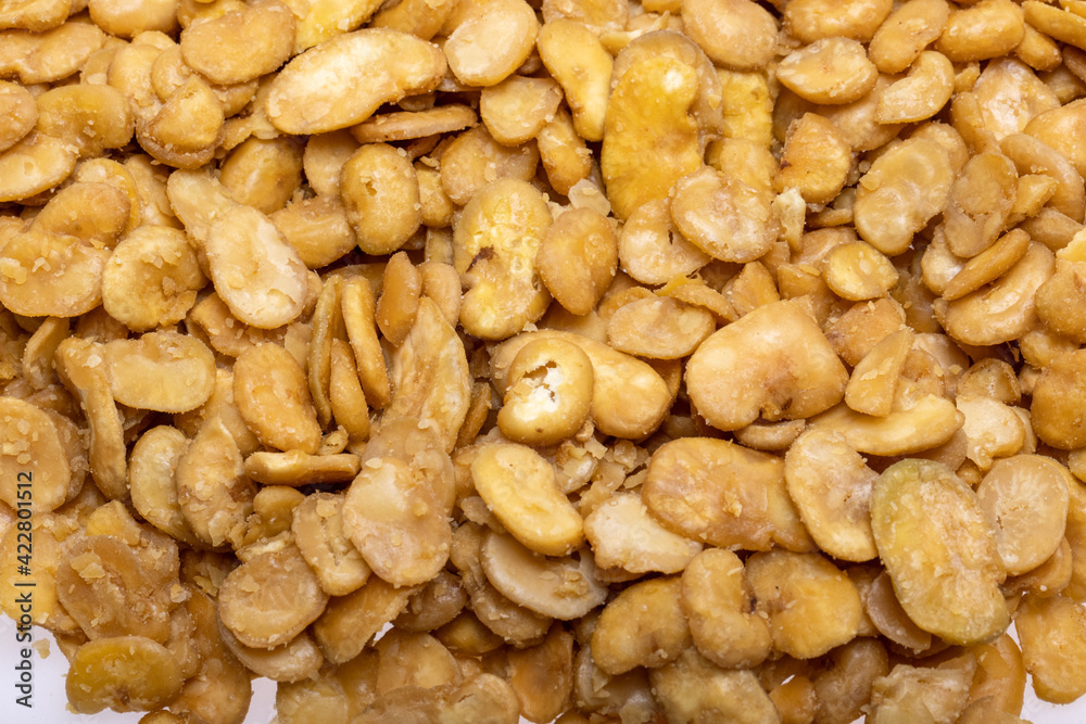 Roasted and salted fava beans for a healthy vegan and vegetarian diet snack. High in protein, vitamins, dietary fibre and nutrients Roasted and salted fava beans for a healthy vegan and vegetarian diet snack. High in protein, vitamins, dietary fibre and nutrients