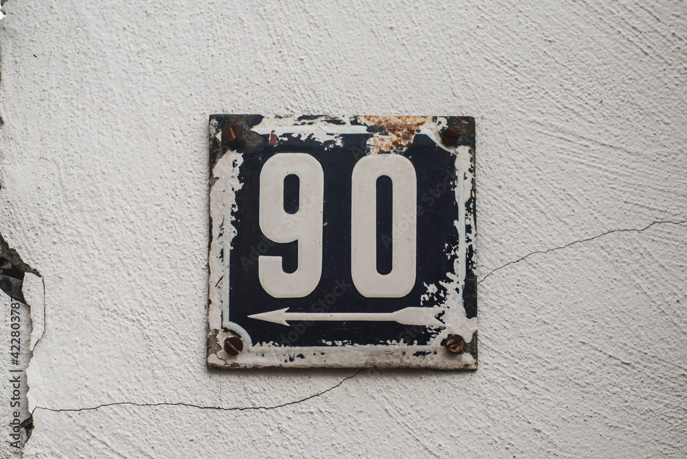 Weathered grunge square metal enamelled plate of number of street address with number 90 Weathered grunge square metal enamelled plate of number of street address with number 90