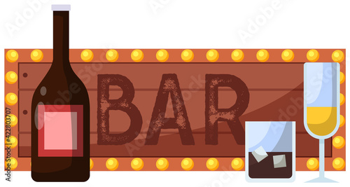 Bar inscription on sign with pink background and lights next to bottles and alcoholic cocktails