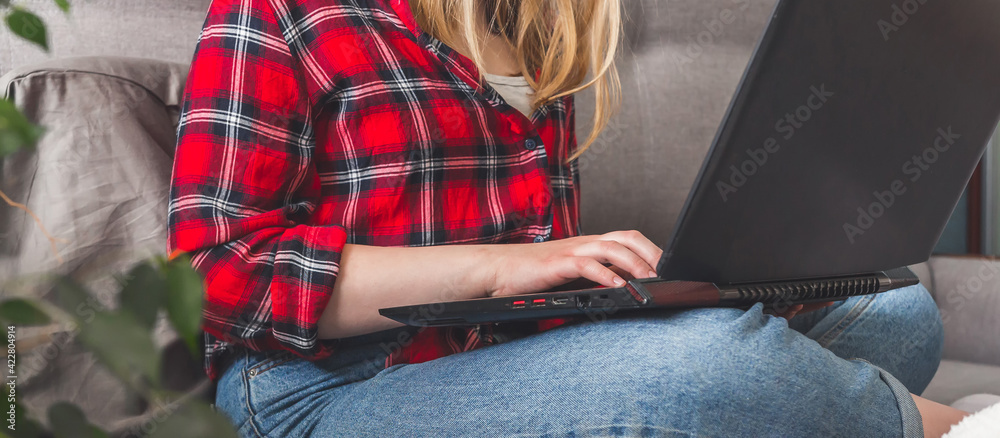 Coronavirus. Quarantine. Online training, remote work, office at home in bed Remote work, training, education. The girl is studying, working remotely. Coronavirus pandemic in the world.covid 19