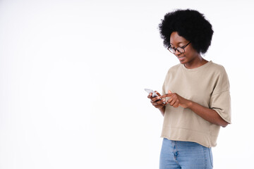 Happy cheerful african girl using smart phone isolated in white background