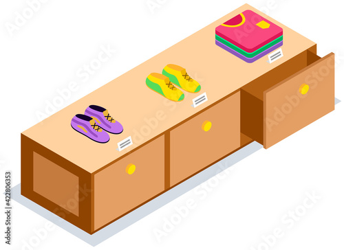 Fashion stylish clothes at clothing store or apparel boutique. Wardrobe with shoes and t-shirts