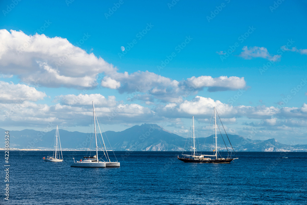 Sailboats and catamarans on the bay of Naples, Italy