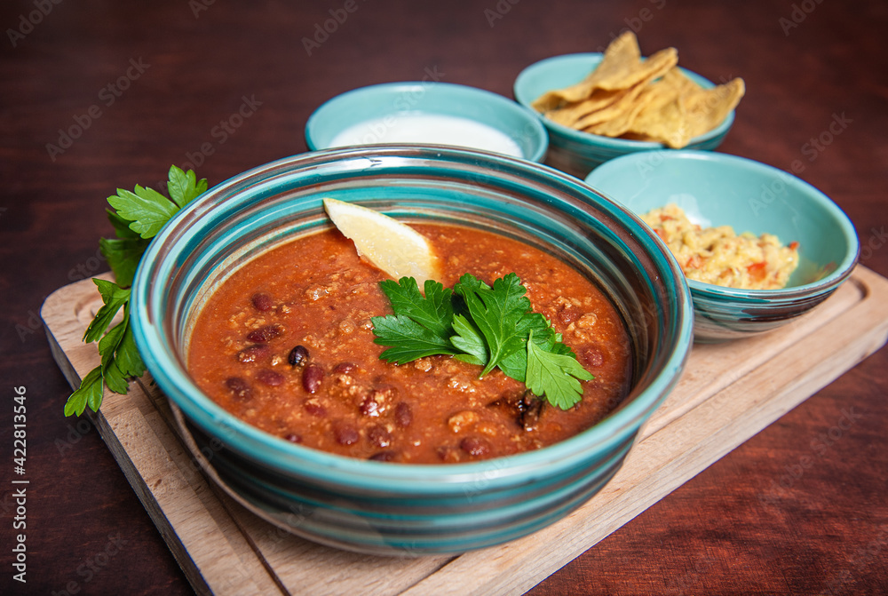 Chili spicy bean soup with fresh green parsley Chili spicy bean soup with fresh green parsley