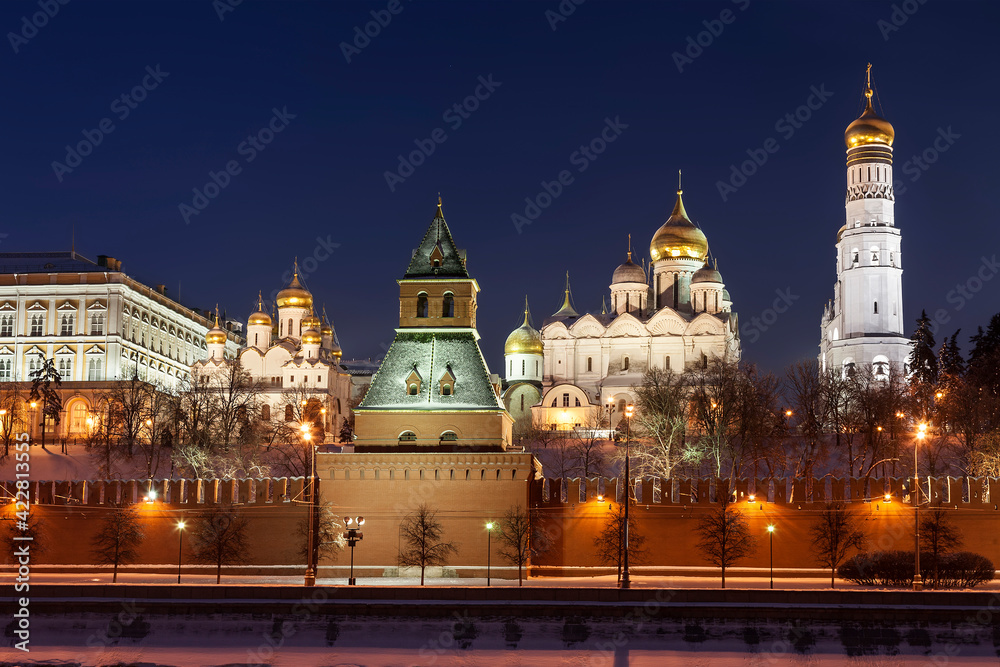 View of the night Kremlin with cathedrals and the bell tower of Ivan the Great in winter. Moscow, Russia