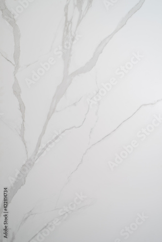 Ceramic porcelain stoneware tile texture or pattern. Natural stone white color with veining