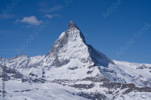 Beautiful winter mountain panorama with famous peak Matterhorn (4478m) seen from Gornergrat, Zermatt, Switzerland. Photo taken March 23rd, 2021.