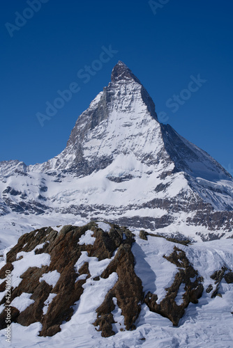 Beautiful winter mountain panorama with famous peak Matterhorn (4478m) seen from Gornergrat, Zermatt, Switzerland. Photo taken March 23rd, 2021. photo