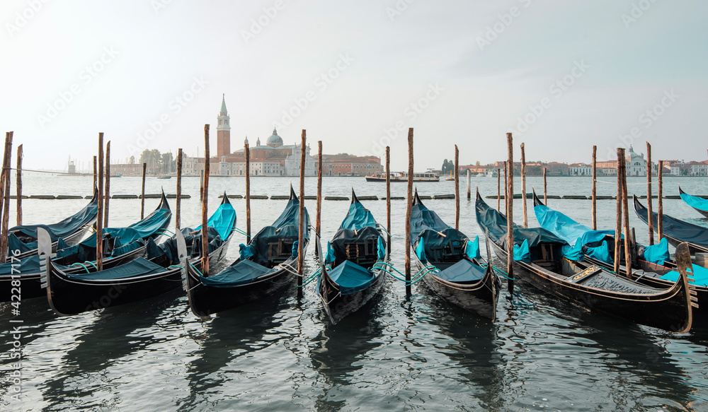 panoramic view of the grand canal of venice with gondolas and San Giorgio Maggiore in the background