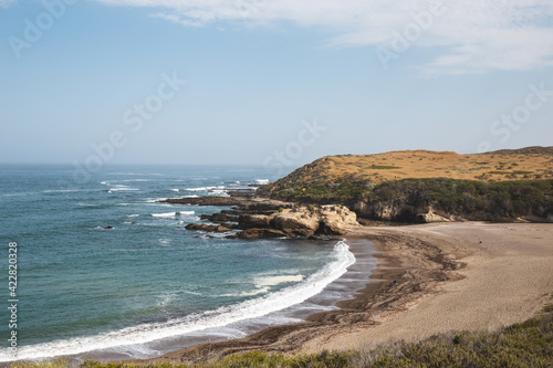 Beautiful shoreline and sandy beach at Montana De Oro State Park, California	
