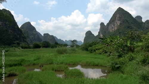 Static view of Yangshuo jungle in China very popular chinese tourist destination for both foreign as domestic tourists area is known for the karst pointy peaks mountains 4k high resolution quality photo