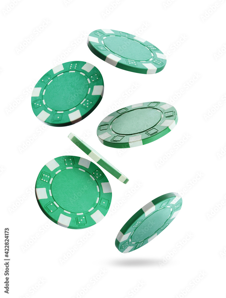 Green casino chips falling on white background