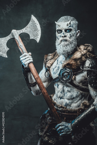Armed with axe dead king in atmospheric dark background