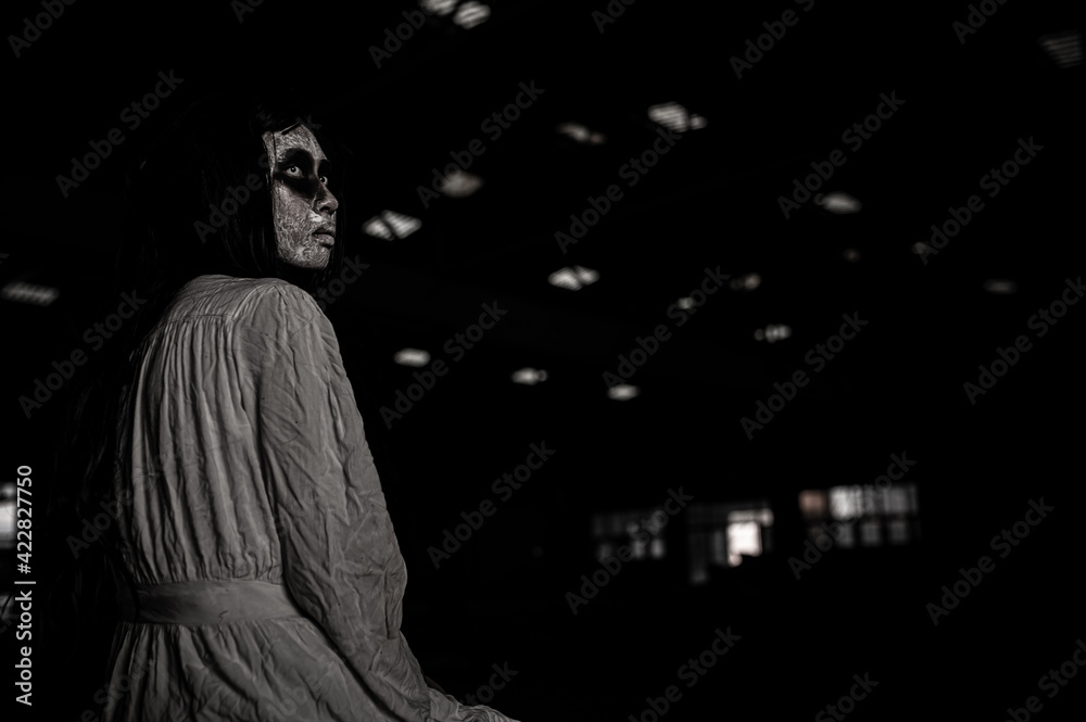 Portrait of asian woman make up ghost face,Horror scene,Scary background,Halloween poster Portrait of asian woman make up ghost face,Horror scene,Scary background,Halloween poster