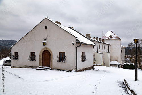 White castle in snow. Lesko town. Poland