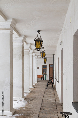 White portico, decorated lanterns. photo