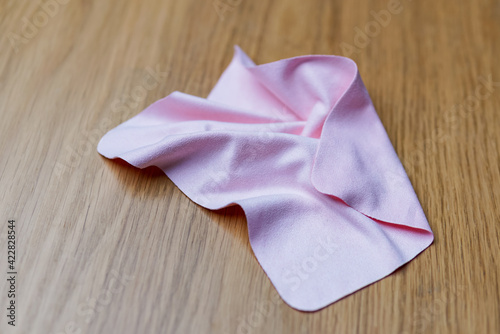 pink soft cloth on a wooden desk