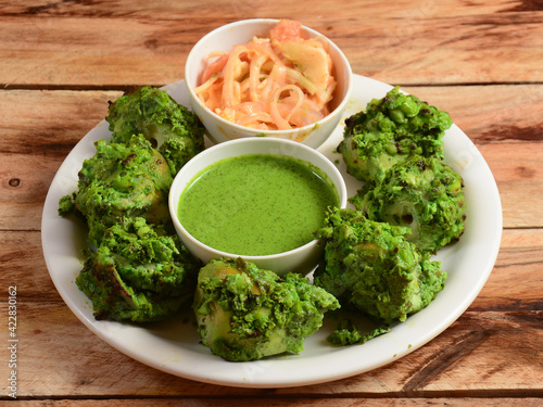 Assorted indian food Chicken pahadi kebab served on wooden background. Dishes and appetizers of indian cuisine, selective focus photo