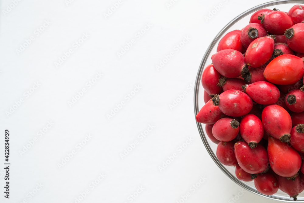 Rose-hips or wild rose berries isolated on a white background. Rose-hips or wild rose berries isolated on a white background.