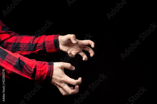 Crooked male hands, reaching for something. Emotions, stress, epilepsy, or other neurological disease. photo