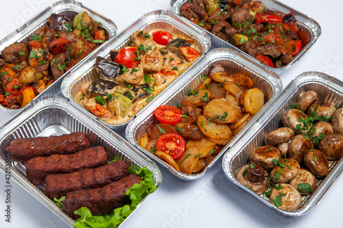 Business lunch in eco plastic container ready for delivery.Top view. Office Lunch boxes with food ready to go. Food takes away. Catering, brakfast.