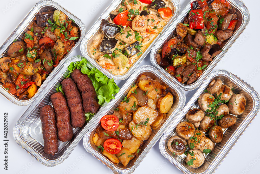 Business lunch in eco plastic container ready for delivery.Top view. Office Lunch boxes with food ready to go. Food takes away. Catering, brakfast. Business lunch in eco plastic container ready for delivery.Top view. Office Lunch boxes with food ready to go. Food takes away. Catering, brakfast.