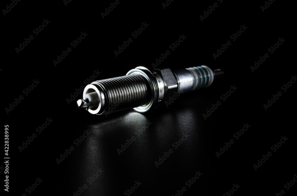 spark plugs for a car engine on a dark background Stock-Foto | Adobe Stock