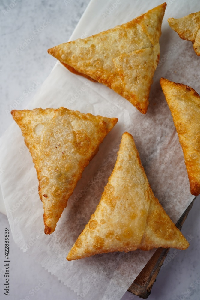 Homemade Samosas - Indian deep fried triangle pastries, selective focus