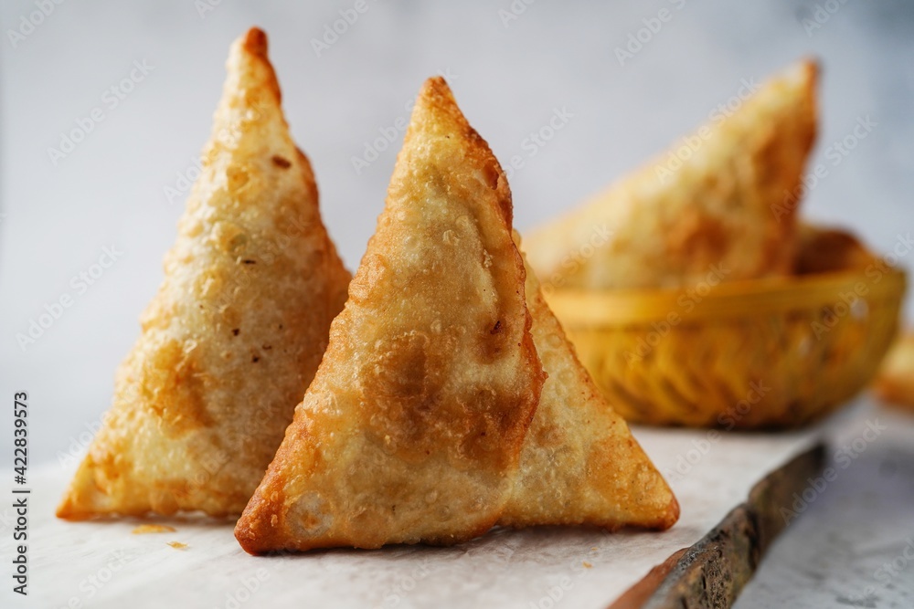 Homemade Samosas - Indian deep fried triangle pastries, selective focus