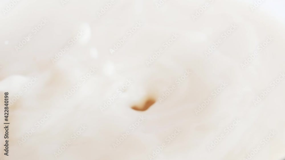 hazelnut chocolate falling into milk hazelnut chocolate falling into milk